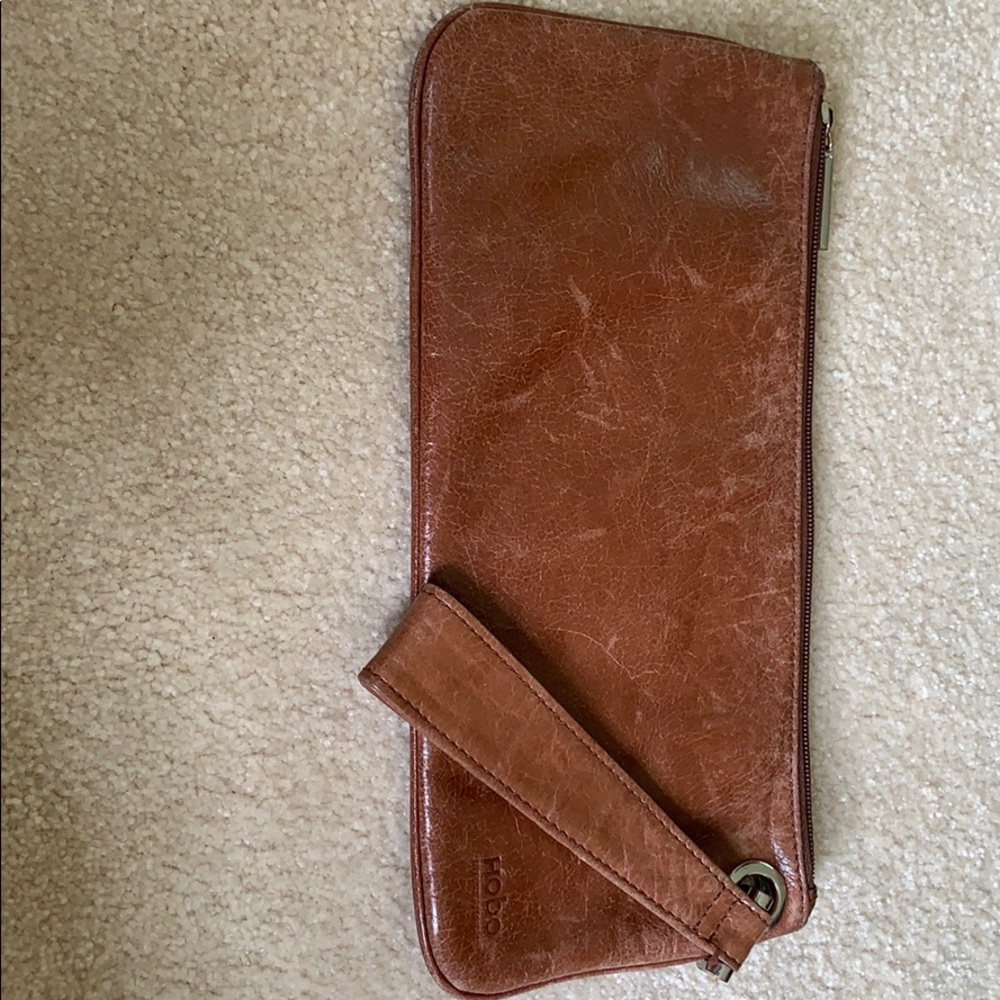 Hobo wristlet in battered brown leather.